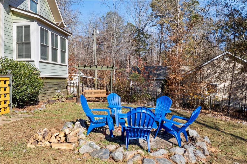 243 Bluegill Road Eatonton, GA 31024 - Photo 120 of 136 a backyard of a house with table and chairs