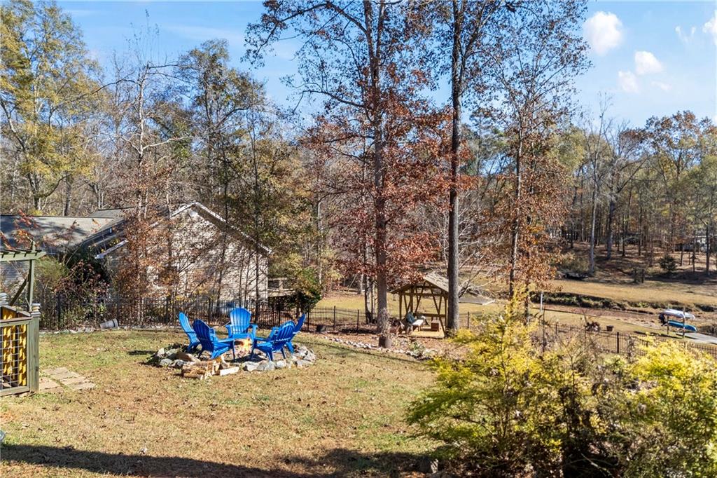 243 Bluegill Road Eatonton, GA 31024 - Photo 121 of 144 a view of yard with swimming pool and sitting area