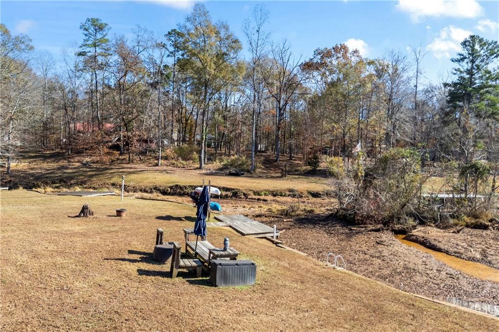 243 Bluegill Road Eatonton, GA 31024 - Photo 128 of 144 a view of a yard with a tree