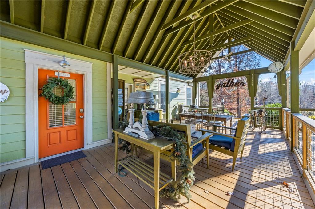243 Bluegill Road Eatonton, GA 31024 - Photo 14 of 144 a view of a dinning tables and chairs in patio of the house