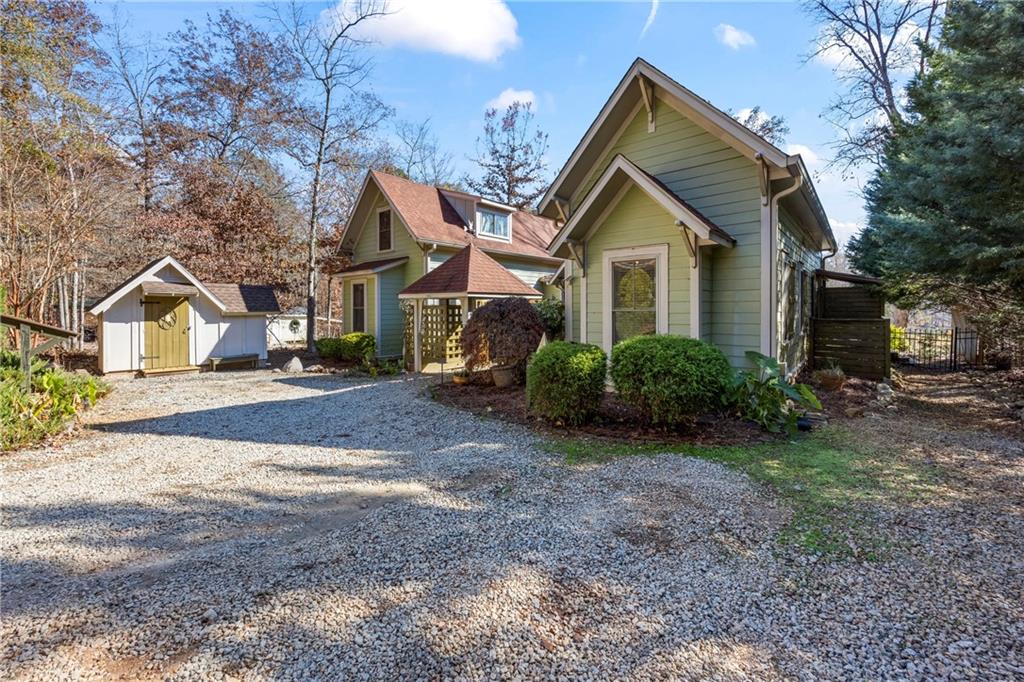 243 Bluegill Road Eatonton, GA 31024 - Photo 141 of 144 a front view of a house with garden