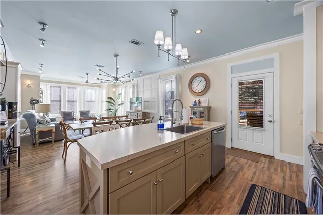 a kitchen with stainless steel appliances a stove and a refrigerator