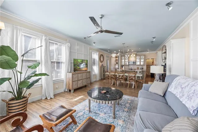a bathroom with a double vanity sink mirror and bathtub