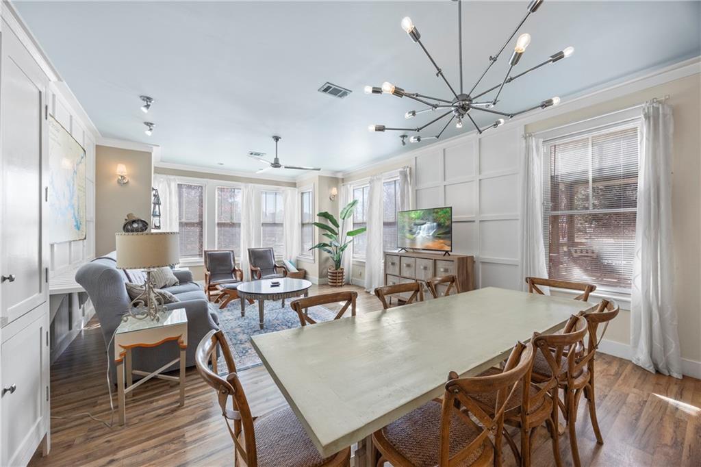 243 Bluegill Road Eatonton, GA 31024 - Photo 22 of 144 a view of a dining room with furniture and wooden floor