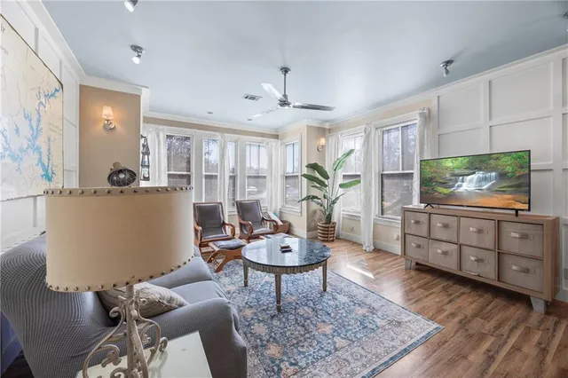 a view of a dining room with furniture and wooden floor