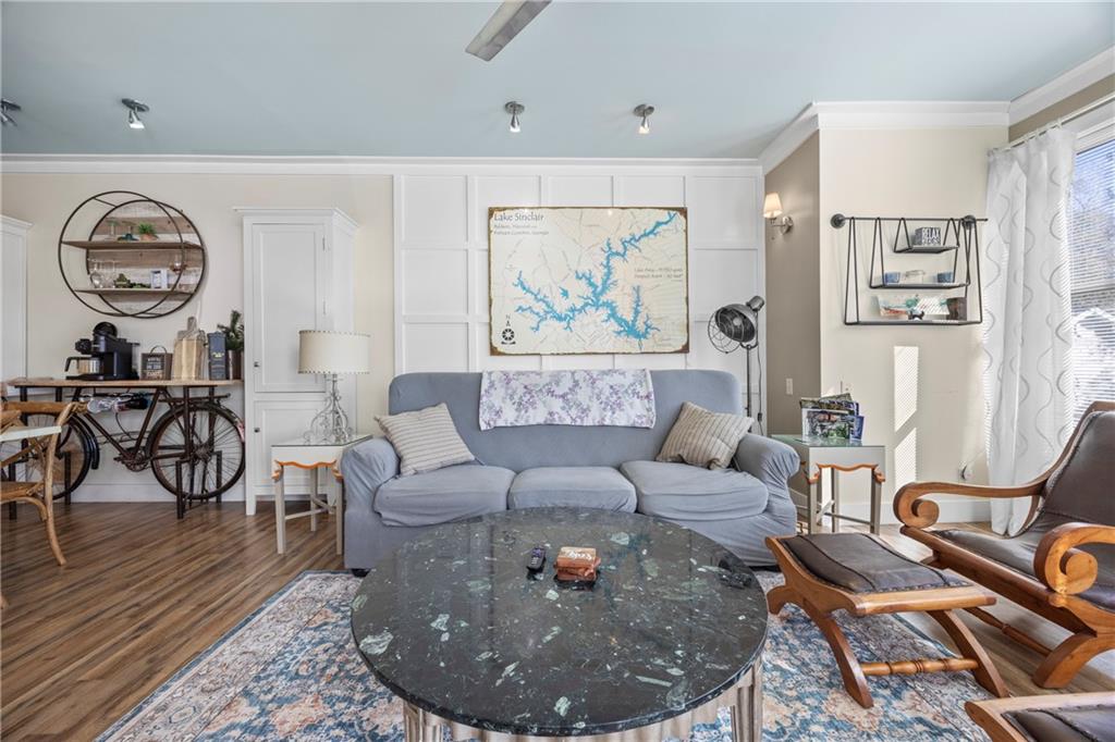 243 Bluegill Road Eatonton, GA 31024 - Photo 32 of 144 a living room with furniture a rug and wall paintings