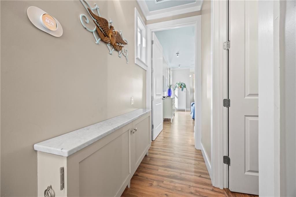 243 Bluegill Road Eatonton, GA 31024 - Photo 39 of 144 a view of a hallway with wooden floor and staircase