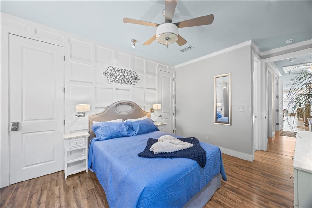 243 Bluegill Road Eatonton, GA 31024 - Photo 41 of 144 a bedroom with a bed and wooden floor