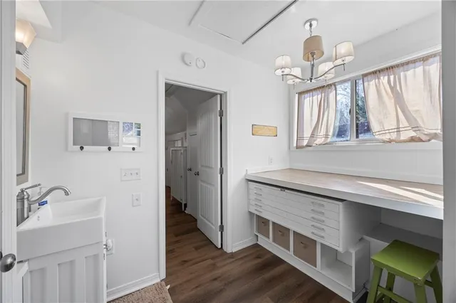 a view of a swimming pool with sitting area and covered with snow
