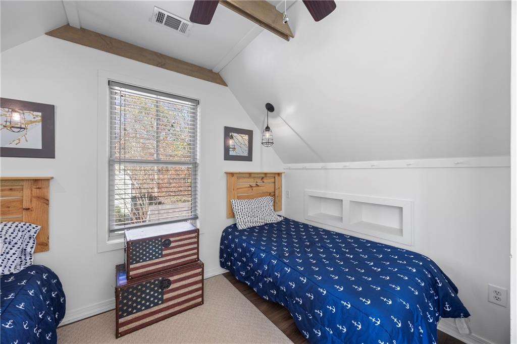 243 Bluegill Road Eatonton, GA 31024 - Photo 54 of 144 a bedroom with a bed and wooden floor