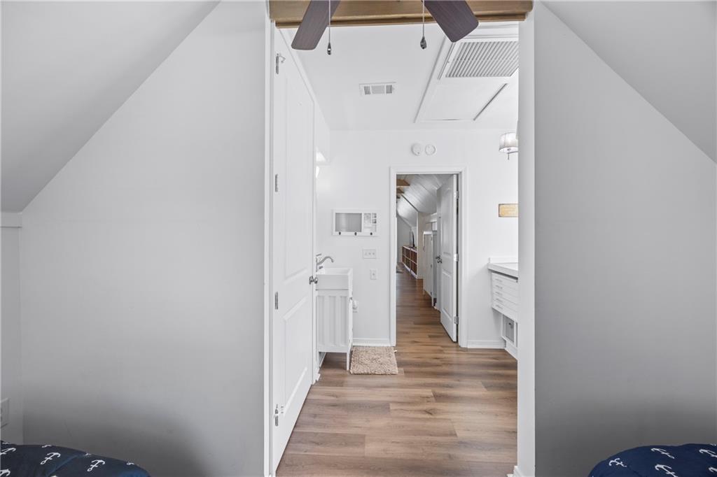 243 Bluegill Road Eatonton, GA 31024 - Photo 55 of 144 a view of a hallway with wooden floor and closet