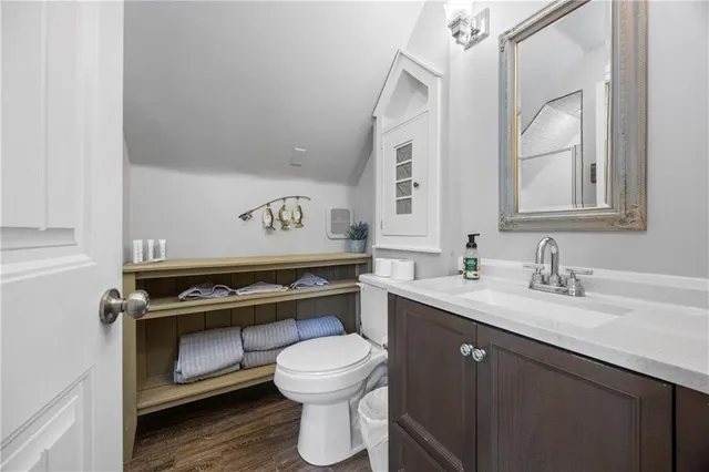 a view of a yard with wooden fence