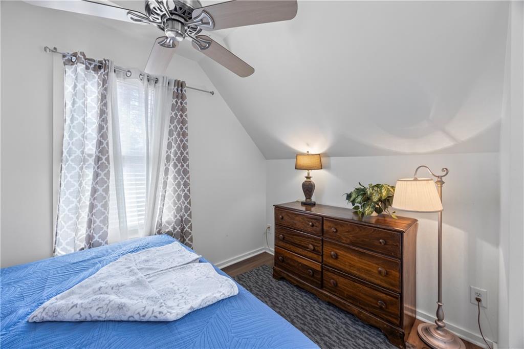 243 Bluegill Road Eatonton, GA 31024 - Photo 68 of 144 a bedroom with a bed and wooden floor