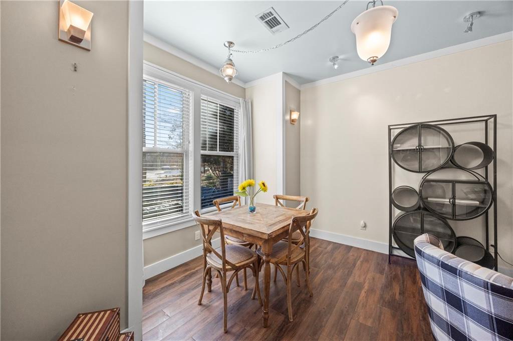 243 Bluegill Road Eatonton, GA 31024 - Photo 71 of 144 a view of a dining room with furniture and wooden floor