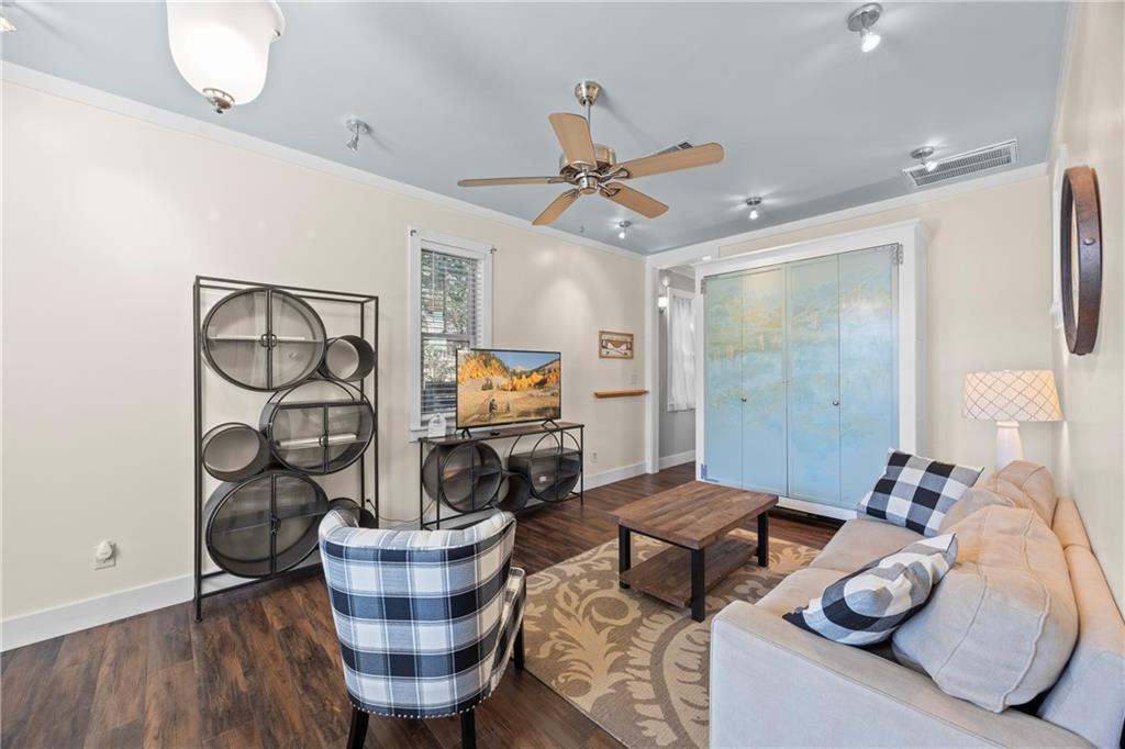 243 Bluegill Road Eatonton, GA 31024 - Photo 74 of 144 a living room with furniture and a wooden floor