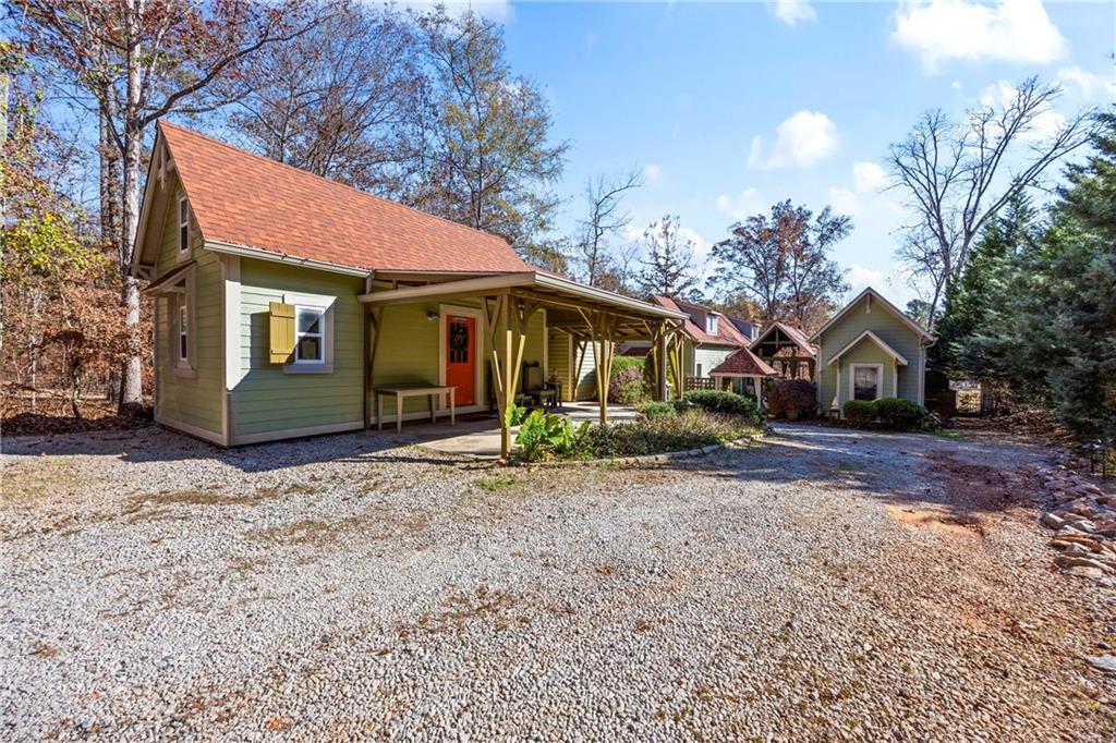 243 Bluegill Road Eatonton, GA 31024 - Photo 88 of 144 a front view of a house with garden