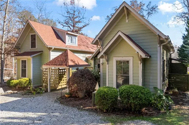 a kitchen with stove a dining table chairs and wooden floor