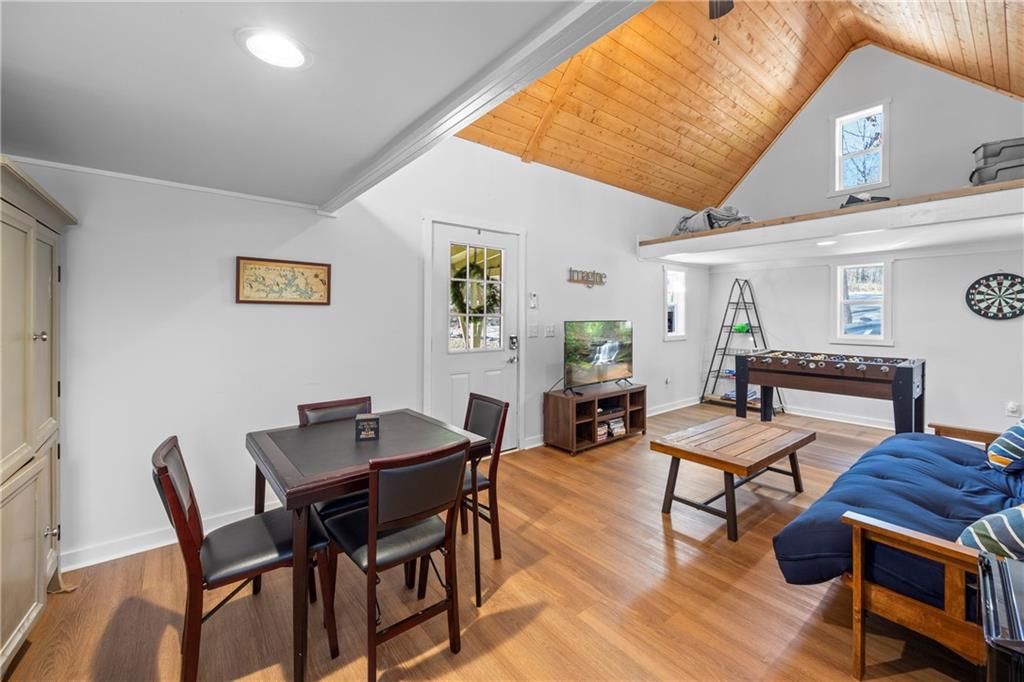 243 Bluegill Road Eatonton, GA 31024 - Photo 98 of 144 a view of a dining room with furniture and wooden floor