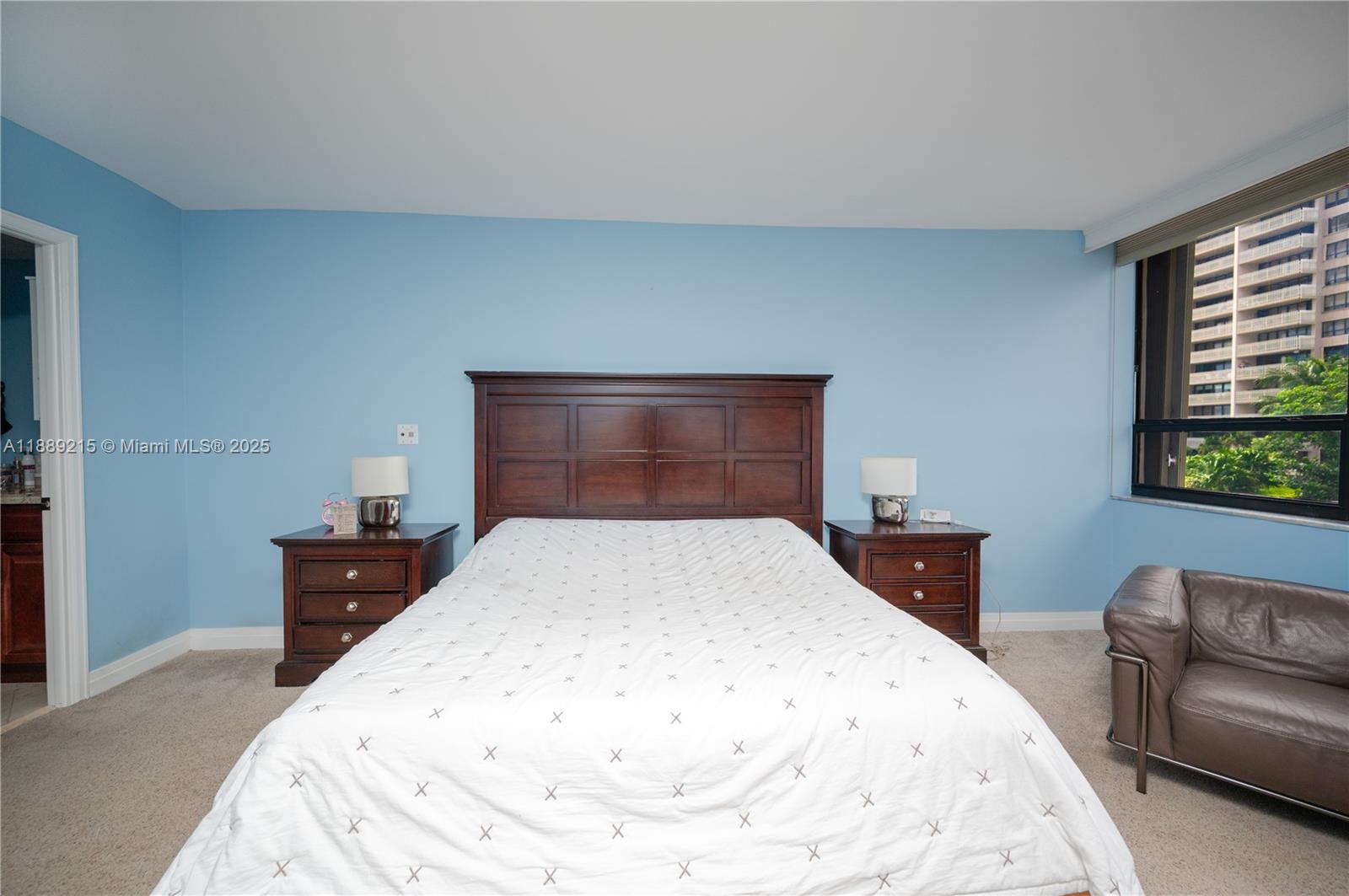 3 Grove Isle Drive, Unit C308 Miami, FL 33133 - Photo 14 of 54 a bedroom with a bed and a couch