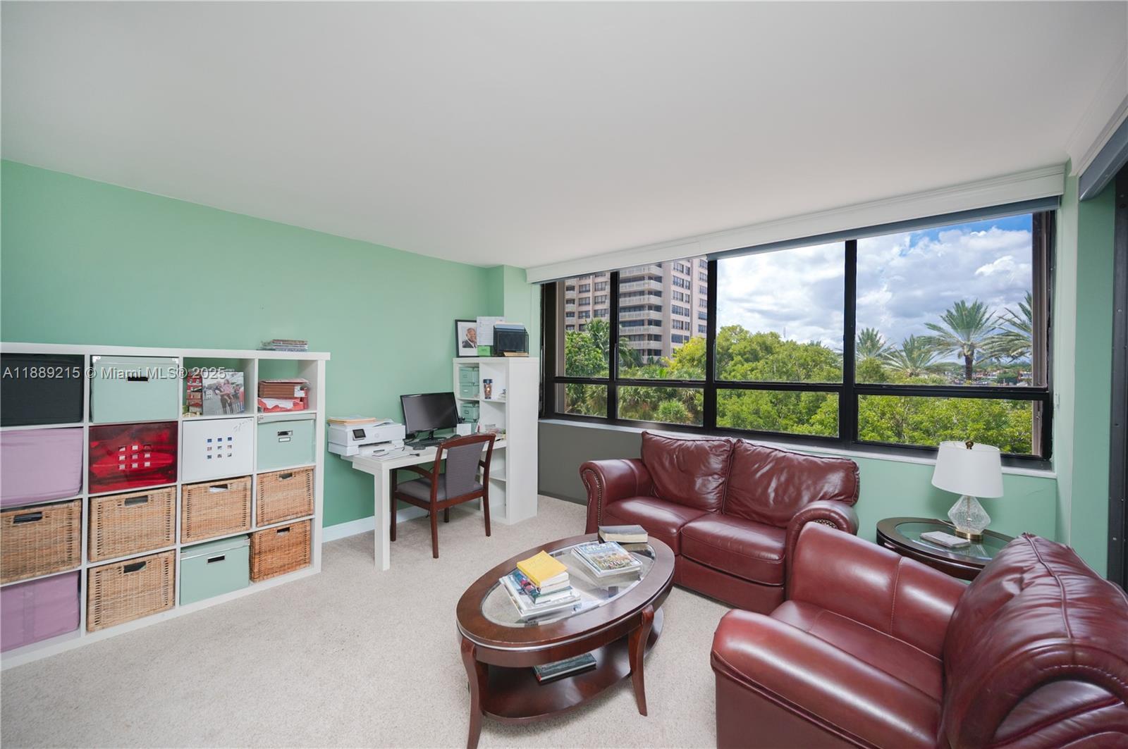 3 Grove Isle Drive, Unit C308 Miami, FL 33133 - Photo 19 of 54 a living room with furniture and a large window