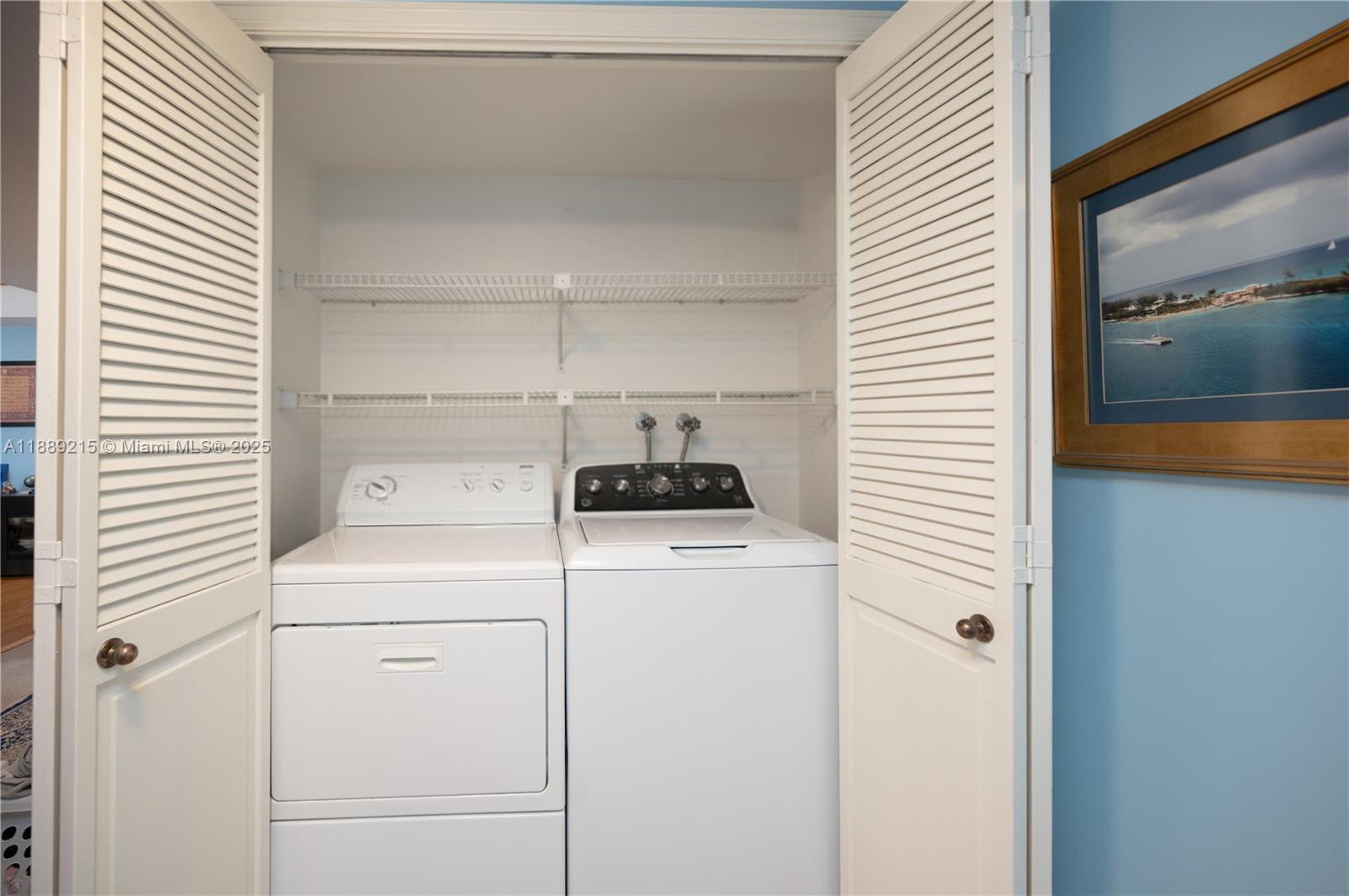 3 Grove Isle Drive, Unit C308 Miami, FL 33133 - Photo 20 of 54 a utility room with dryer and washer