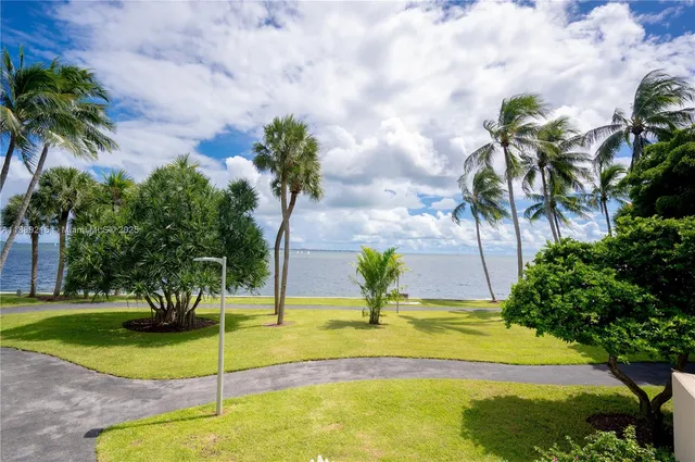 a view of a lake with a yard