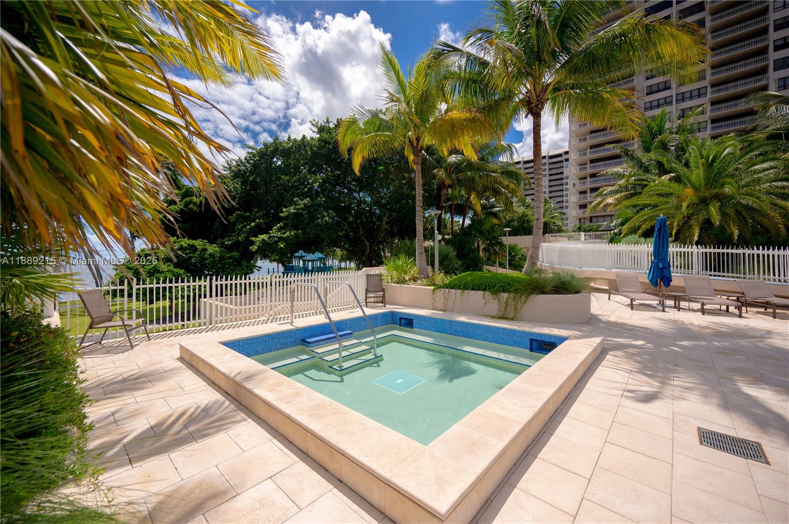 3 Grove Isle Drive, Unit C308 Miami, FL 33133 - Photo 32 of 54 a view of a swimming pool with a patio