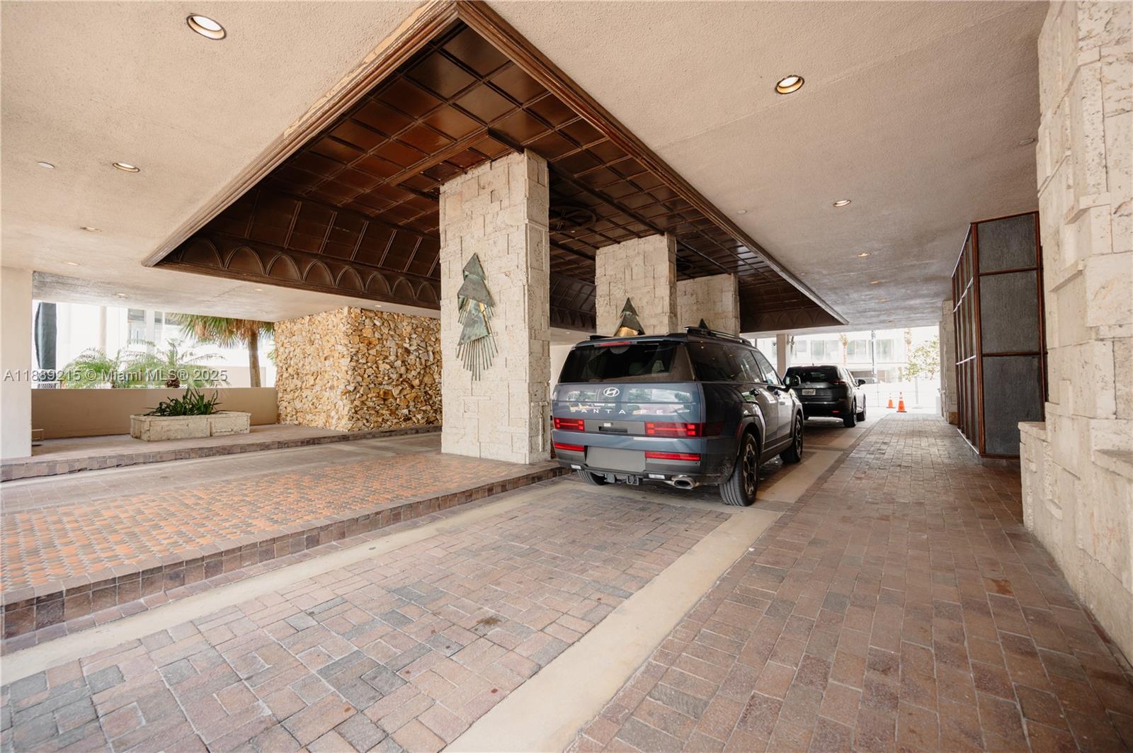 3 Grove Isle Drive, Unit C308 Miami, FL 33133 - Photo 41 of 54 a view of a cars parking space