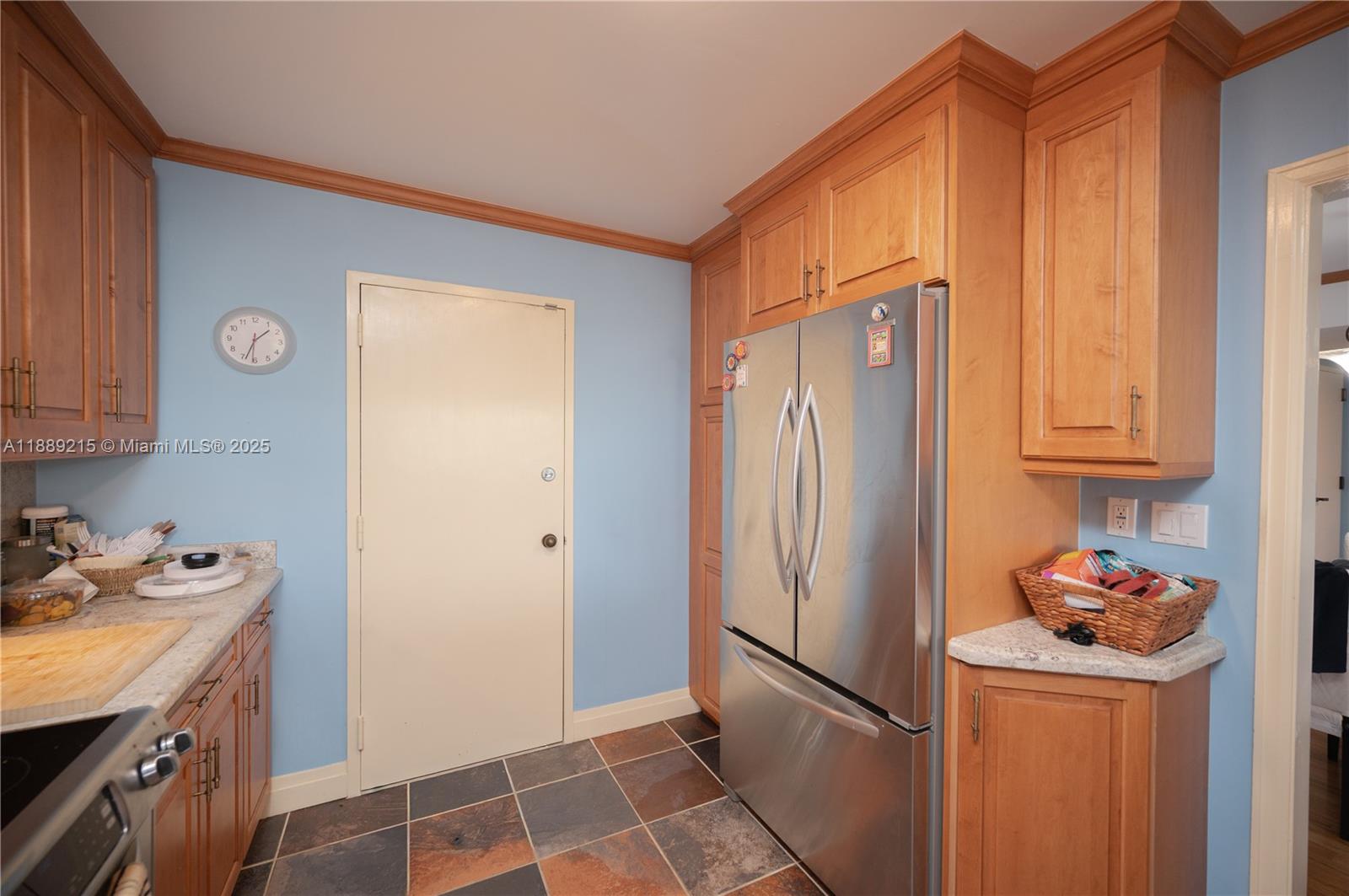 3 Grove Isle Drive, Unit C308 Miami, FL 33133 - Photo 7 of 54 a kitchen with stainless steel appliances granite countertop a refrigerator and a stove