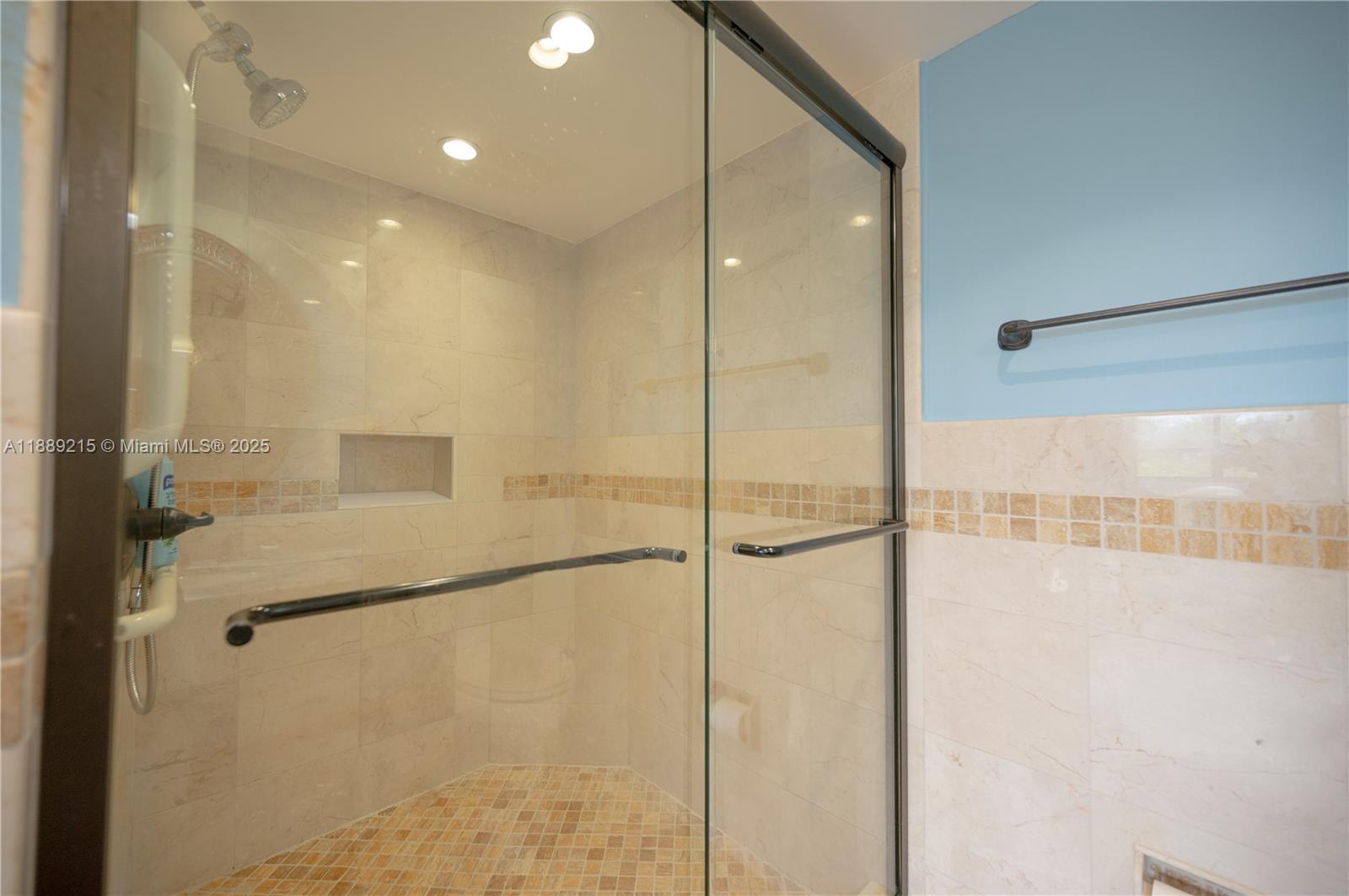 3 Grove Isle Drive, Unit C308 Miami, FL 33133 - Photo 9 of 54 a bathroom with a shower and a glass door