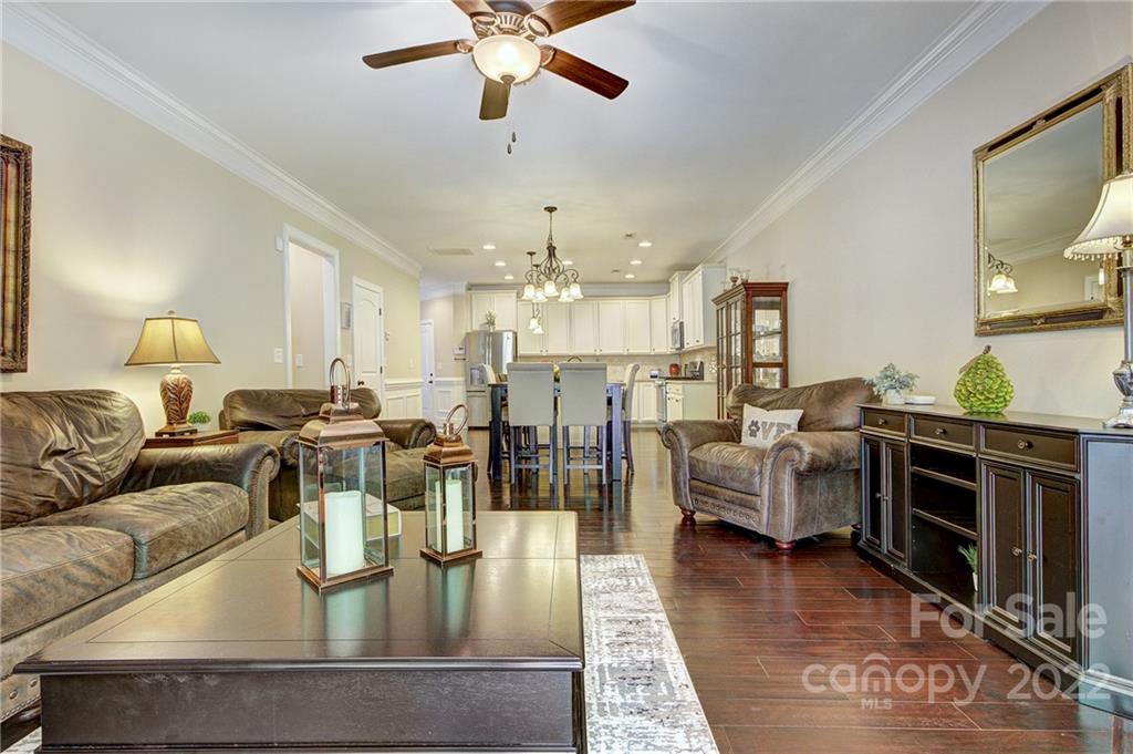 905 Ospre Lane Fort Mill, SC 29708 - Photo 11 of 35 a living room with furniture kitchen view and a chandelier