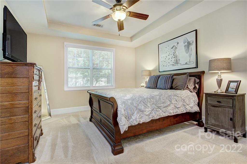 905 Ospre Lane Fort Mill, SC 29708 - Photo 13 of 35 a bedroom with a bed and a flat screen tv