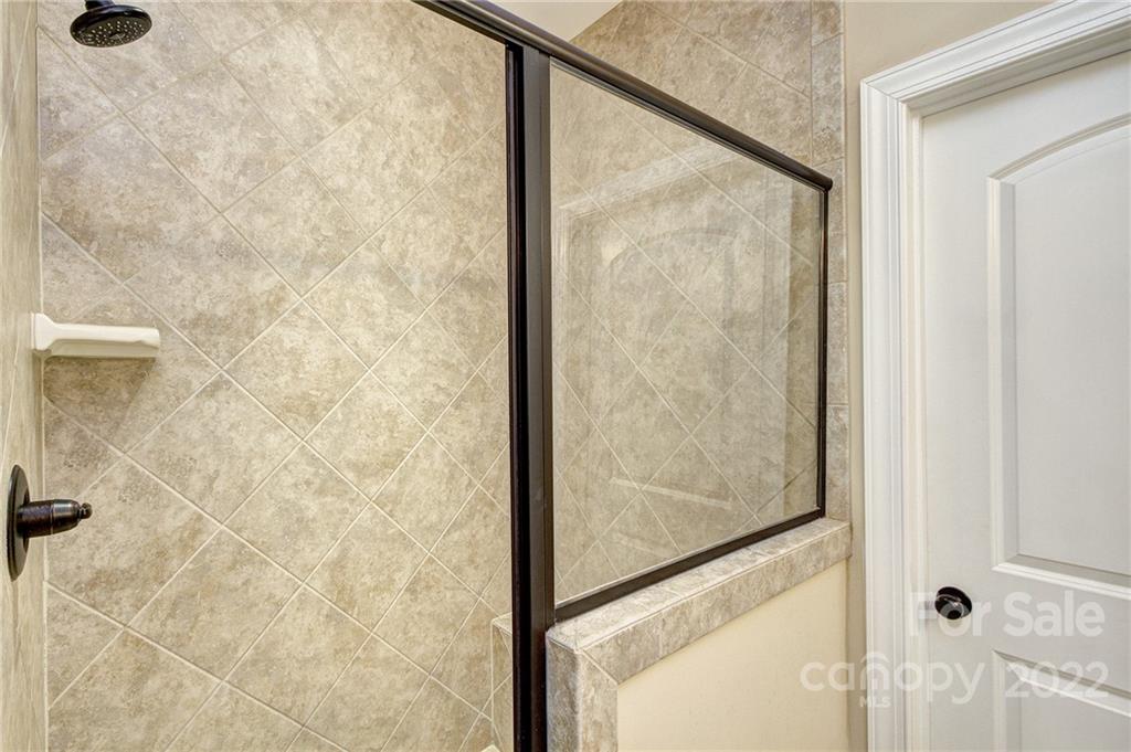 905 Ospre Lane Fort Mill, SC 29708 - Photo 15 of 35 a bathroom with a glass shower door
