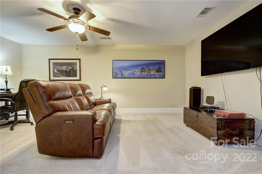 905 Ospre Lane Fort Mill, SC 29708 - Photo 26 of 35 a living room with furniture and a flat screen tv