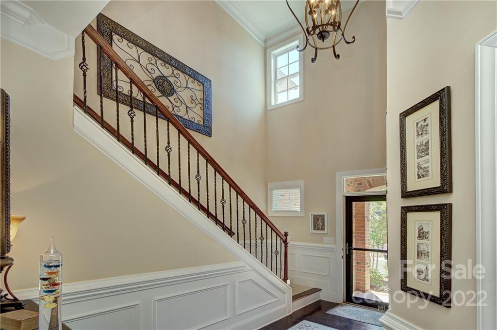 905 Ospre Lane Fort Mill, SC 29708 - Photo 3 of 35 a view of staircase with lots of frames on wall and a window