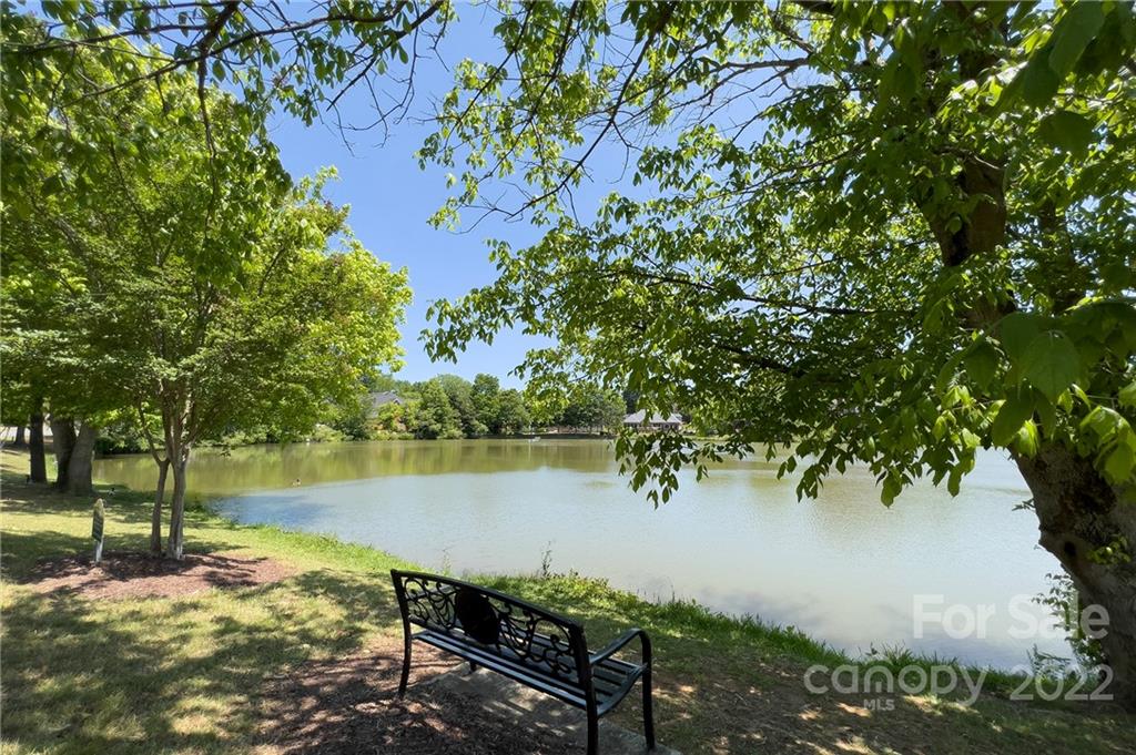 905 Ospre Lane Fort Mill, SC 29708 - Photo 32 of 35 a view of a lake with houses in the back