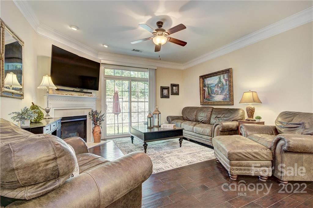 905 Ospre Lane Fort Mill, SC 29708 - Photo 9 of 35 a living room with furniture fireplace and a flat screen tv