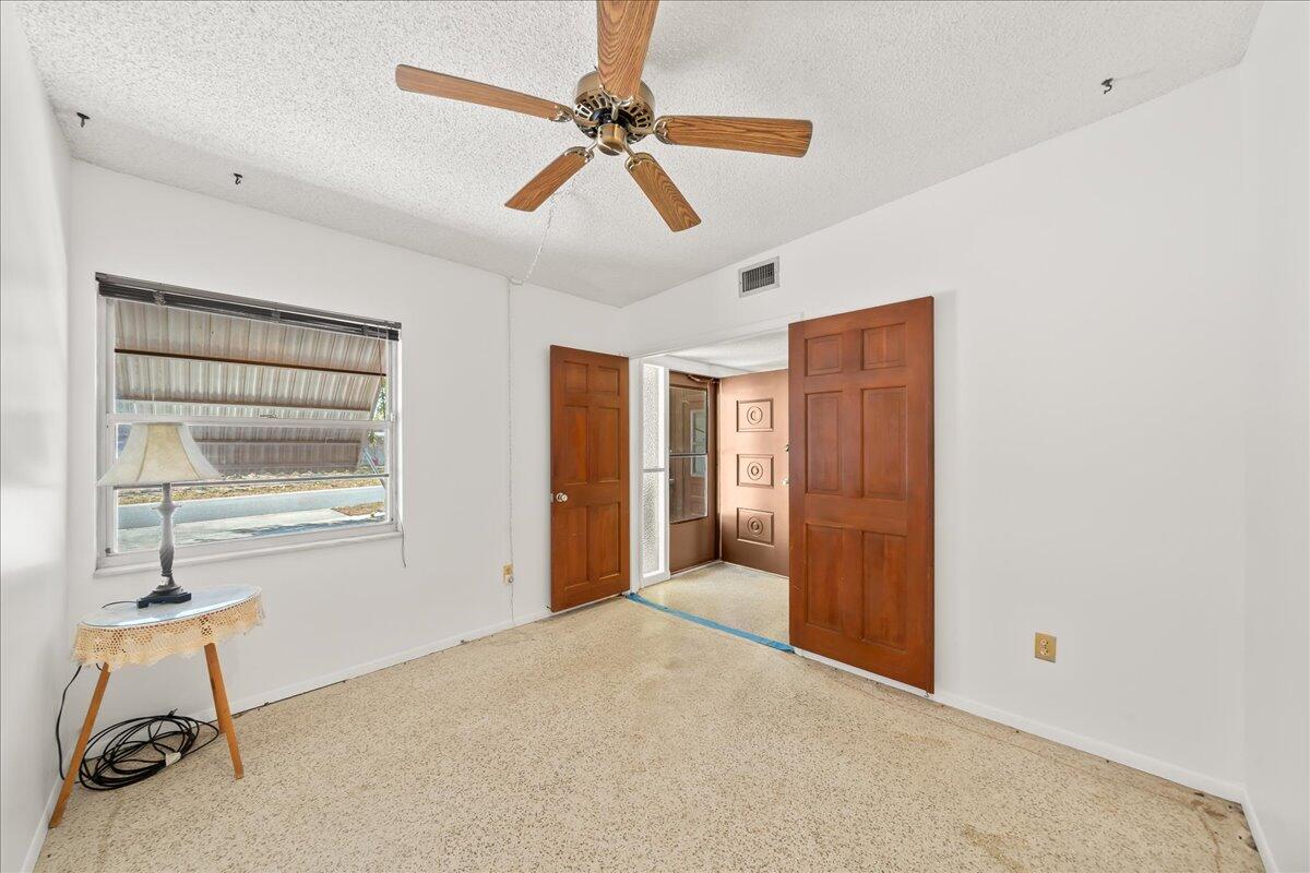 2862 Starlight Circle Northeast Palm Bay, FL 32905 - Photo 13 of 45 a view of an empty room with a window