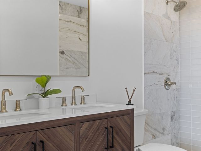 a bathroom with a sink and mirror