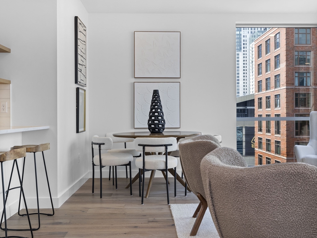 234 Causeway Street, Unit 906 Boston, MA 02114 - Photo 7 of 20 a view of a livingroom with furniture and wooden floor