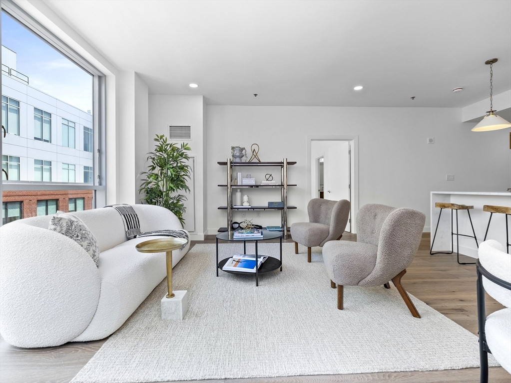 234 Causeway Street, Unit 906 Boston, MA 02114 - Photo 8 of 20 a living room with furniture and a chair