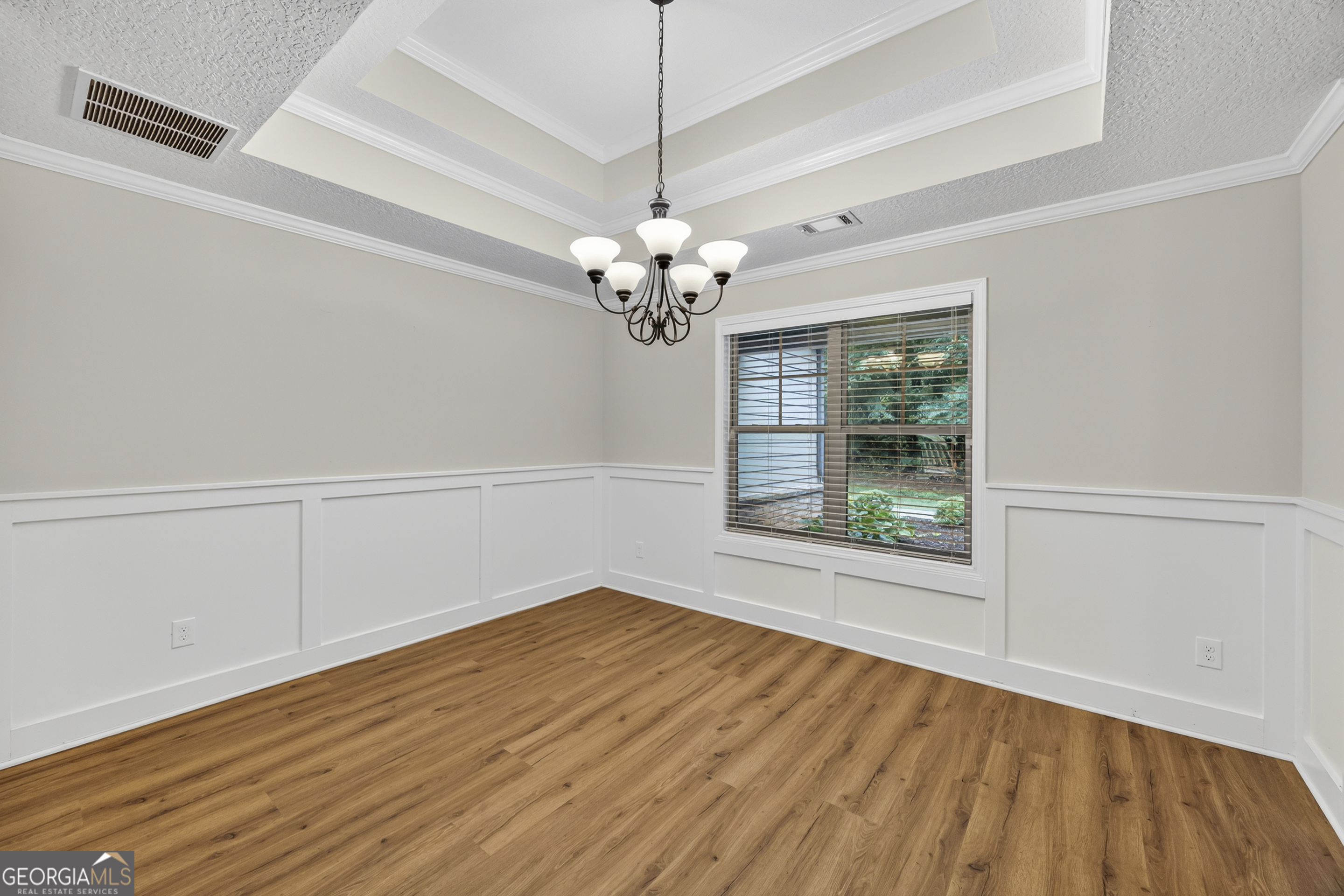 717 Oconee Lane Commerce, GA 30529 - Photo 12 of 57 a view of a room with wooden floor chandelier and a window
