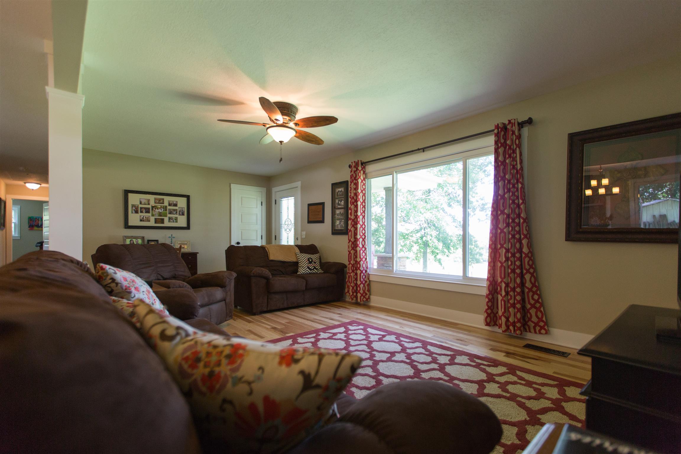4671 Benson Road Springfield, TN 37172 - Photo 14 of 27 a bedroom with a bed and a chandelier