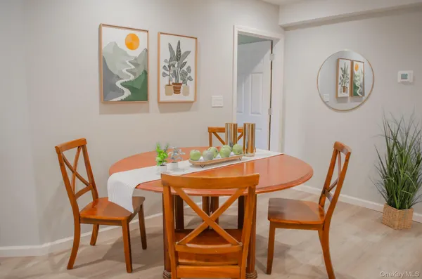 a dining room with furniture and window