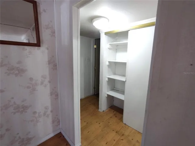 a bathroom with a glass shower door and a sink
