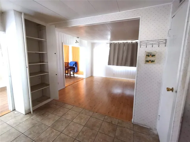 a view of entryway with a rug and a window