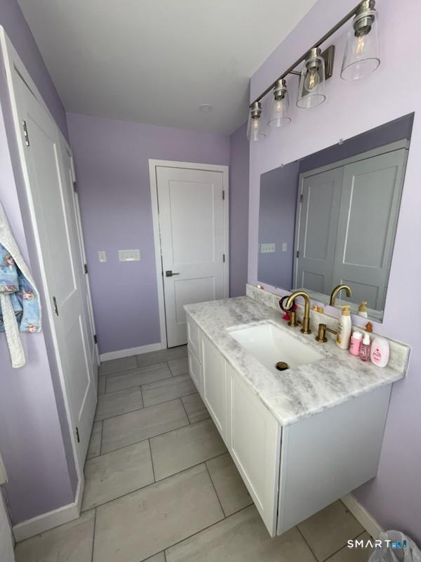 95 Old Breakneck Road Killingly, CT 06241 - Photo 27 of 39 a bathroom with a sink and mirror