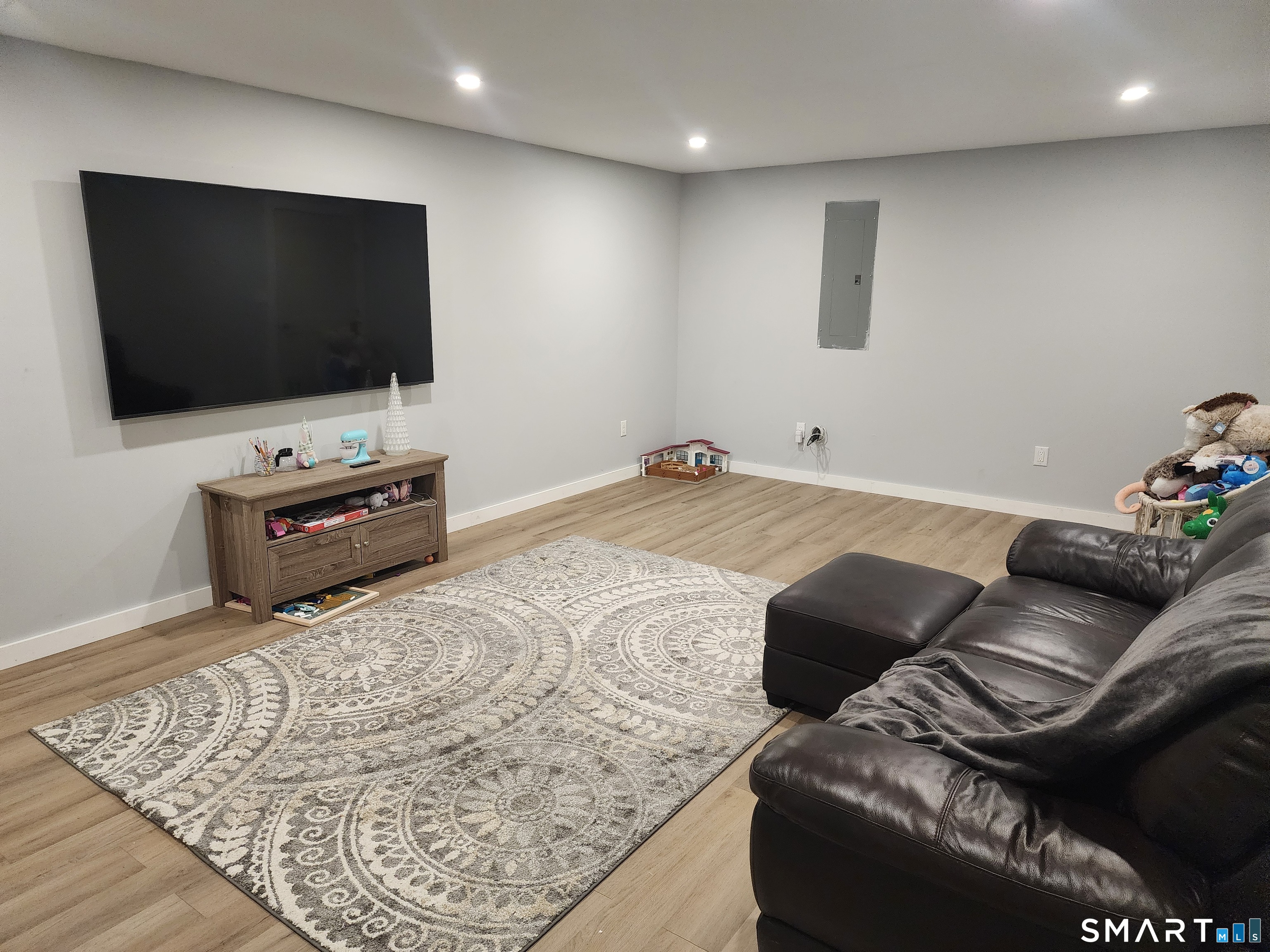95 Old Breakneck Road Killingly, CT 06241 - Photo 29 of 39 a living room with furniture and a flat screen tv