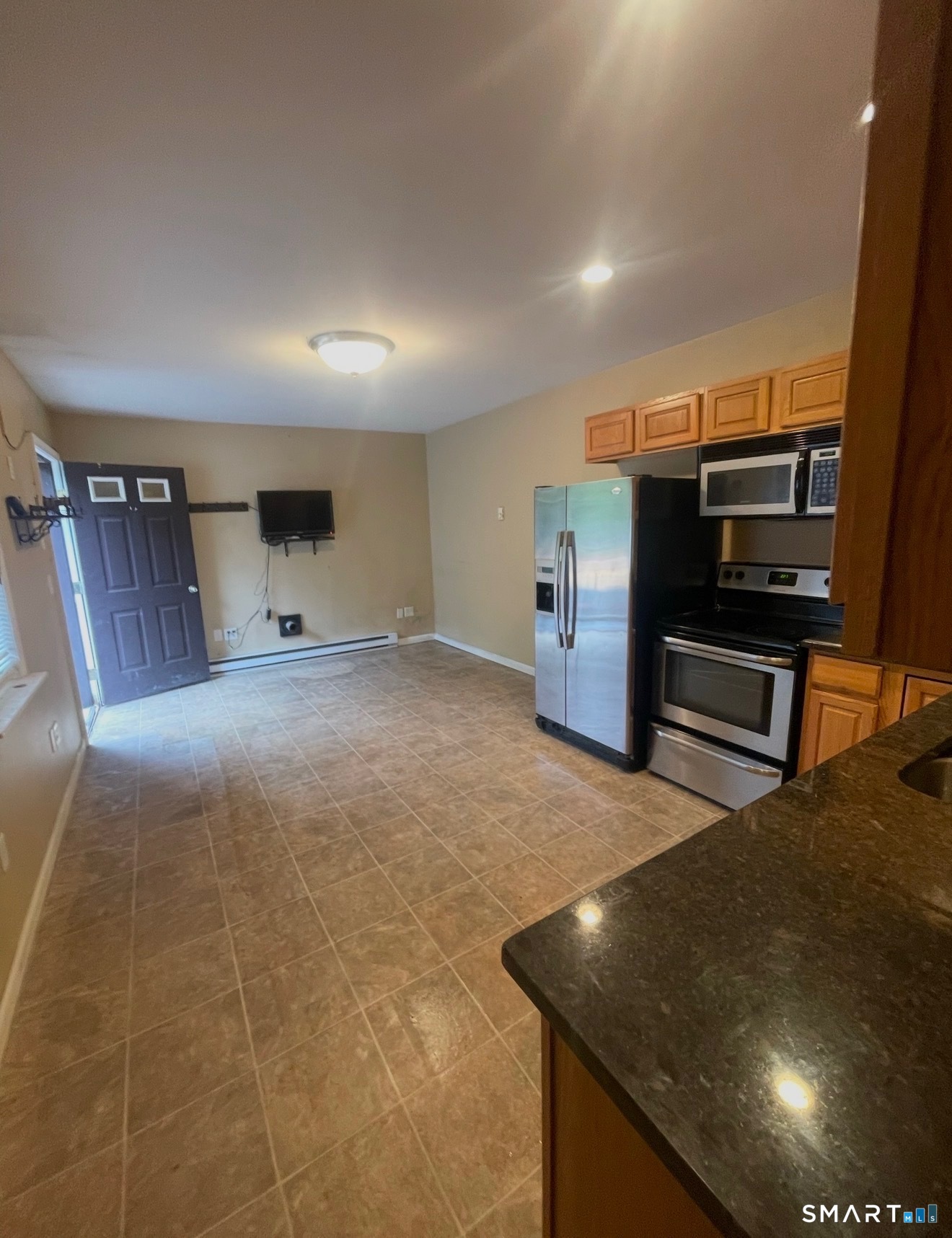 95 Old Breakneck Road Killingly, CT 06241 - Photo 33 of 39 a living room with furniture and a flat screen tv