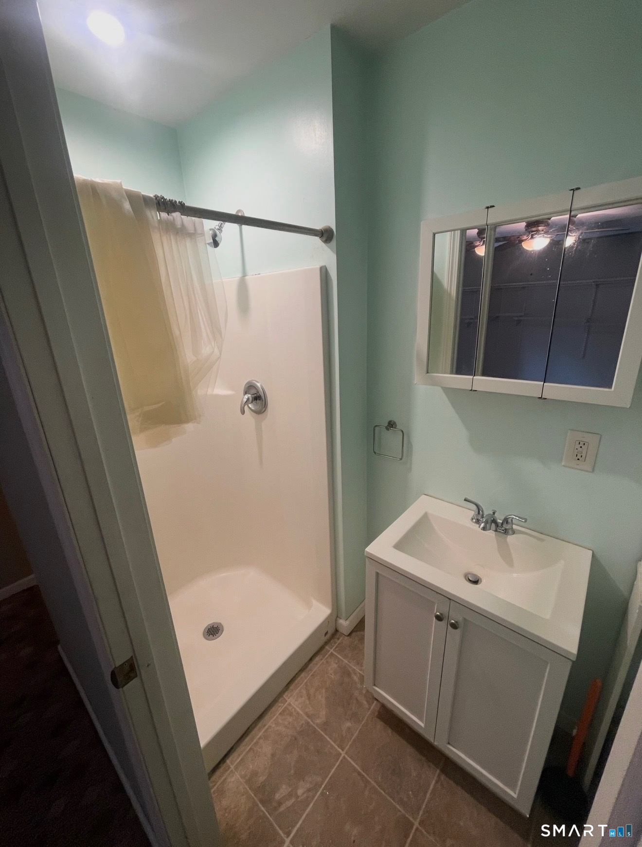 95 Old Breakneck Road Killingly, CT 06241 - Photo 35 of 39 a bathroom with a sink a mirror and shower